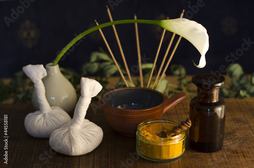 Photo: An arrangement of , spice, oil and massaging tools used in Ayurv An arrangement of , spice, oil and massaging tools used in Ayurv