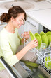 Dishwasher. Young woman in the Kitchen doing Housework. Wash-up