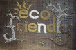 The phrase 'Eco Friendly', written and decorated in seeds