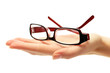 glasses on female hand, isolated on white