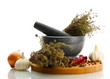 dried herbs in mortar and vegetables, isolatrd on white