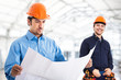 Engineer reading a blueprint