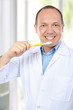 Photo: dentist with toothbrush dentist with toothbrush