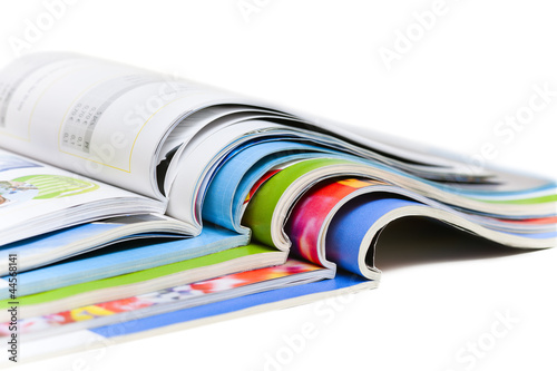 Photo: Color magazines isolated on the white background Color magazines isolated on the white background
