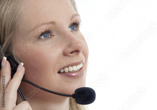 Photo: Frau mit Headset telefonierend Frau mit Headset telefonierend