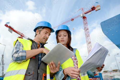 Photo: Construction manager and engineer working on building site Construction manager and engineer working on building site