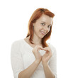 Foto: young beautiful red haired girl forming a heart of her hands young beautiful red haired girl forming a heart of her hands
