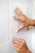 tiler hands at home renovation work
