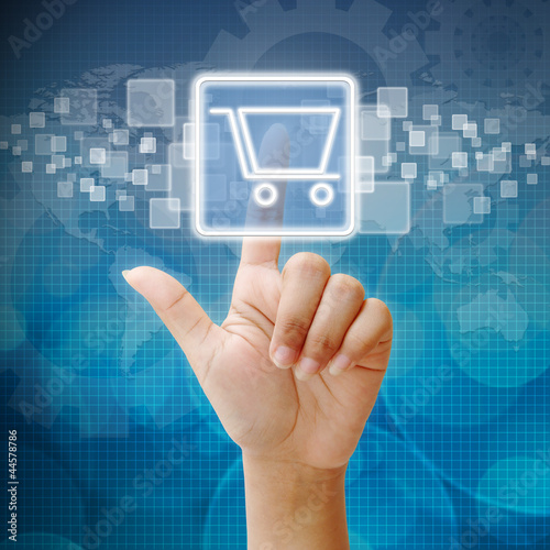 Photo: Hand press on Shopping Cart icon Hand press on Shopping Cart icon
