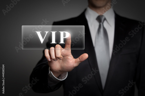 Photo: businessman pressing virtual button - VIP businessman pressing virtual button - VIP