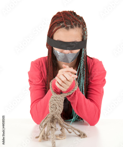 Photo: frightened kidnapped young woman, hostage frightened kidnapped young woman, hostage