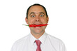 Foto: Man who has a red chili between his teeth Man who has a red chili between his teeth