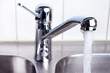 Water flow from chromed steel faucet