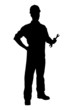 A silhouette of a confident and smiling handyman holding a wrenc