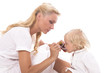 Foto: Mum giving a spoon of syrup to cute little girl Mum giving a spoon of syrup to cute little girl