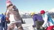 Family Having Snowball Fight In The Mountains