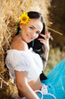 portrait of a girl next to haystack