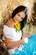 portrait of a girl next to haystack