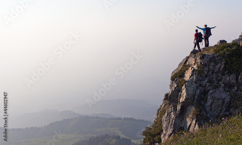 Photo: young couple at the top young couple at the top