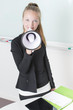 Young adult female holding a bullhorn