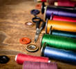 Old sewing accessorie on the old wooden table