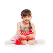 happy child girl holding gift box with kitten