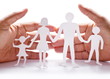 Photo: Cardboard figures of the family on a white background. Cardboard figures of the family on a white background.