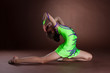 Dramatic kid in gymnast costume posing