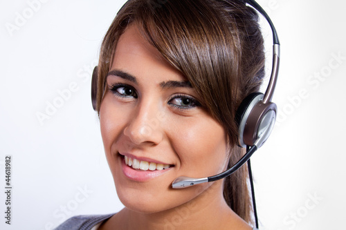 Photo: Operadora de centro de llamadas con auriculares Operadora de centro de llamadas con auriculares