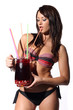 Photo: sexy woman in bikini holding a cocktail with tropical fruits in sexy woman in bikini holding a cocktail with tropical fruits in