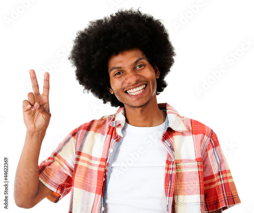 Photo: Black man making a peace sign Black man making a peace sign