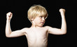 Little boy showing muscles