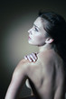 Backache, pretty woman holding upper back