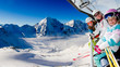 Skiing, winter  - happy family skiers on ski lift