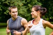 Training together - young couple jogging