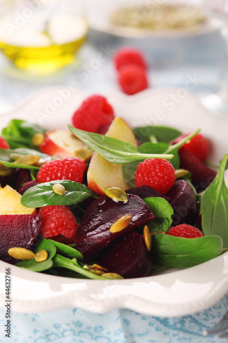 Photo: Fresh vegetarian salad with beets, apples and raspberries. Fresh vegetarian salad with beets, apples and raspberries.