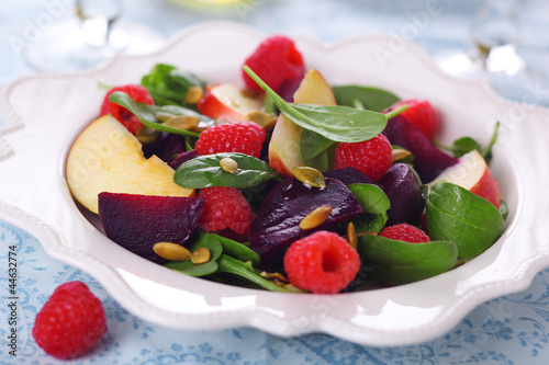 Photo: Fresh vegetarian salad with beets, apples and raspberries. Fresh vegetarian salad with beets, apples and raspberries.