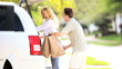 Young Caucasian Couple Preparing Car Weekend Outing