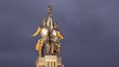Monument to worker and collective farmer stands against sky