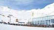 Many skiers go down to mountain bottom