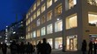 Tourists go on Kartner Strasse near shop