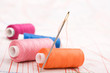 Spool of thread and needle. Sew accessories.