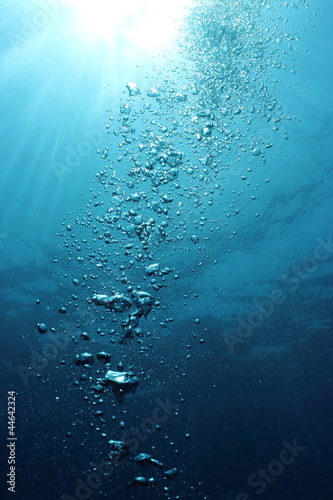 Fototapeta Bubbles undersea and sun rays