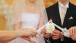 Newly-married couple holds big round candle