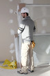 Man installing plaster divide