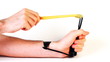 hands man pull elastic band of slingshot and shoot