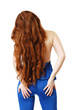 Young woman with long red hair waved