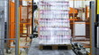 wrapper wraps stretch film bottles of yogurt on pallet