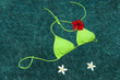Green bikini floating with flowers
