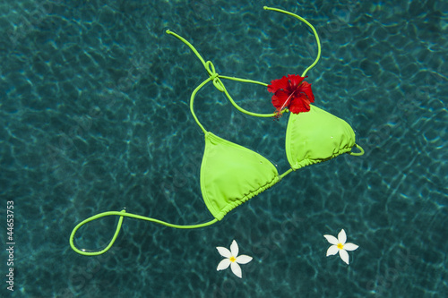Photo: Green bikini floating with flowers Green bikini floating with flowers